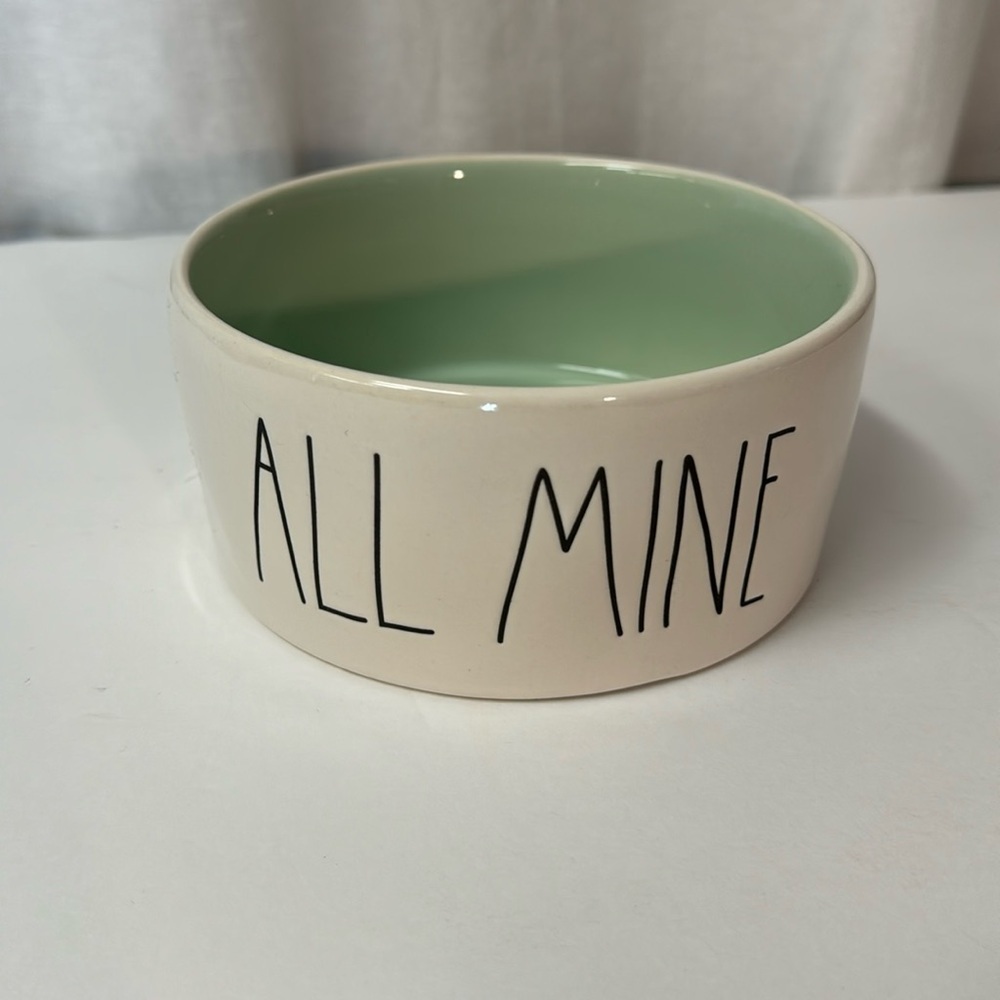 Rae Dunn Medium Pet Bowl “All Mine” with light turquoise interior.